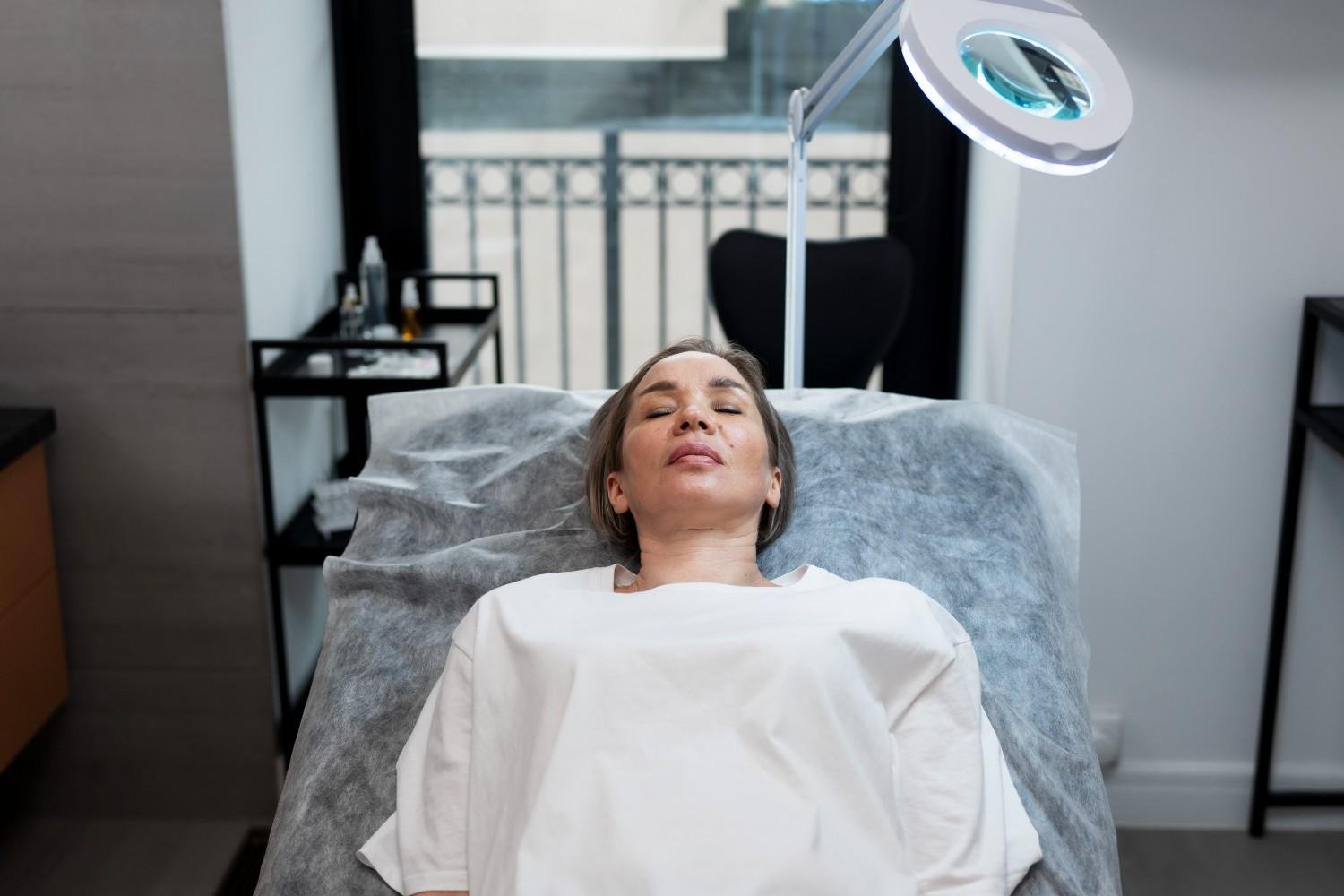 Comfortable patient receiving skin tightening treatment with advanced cooling technology